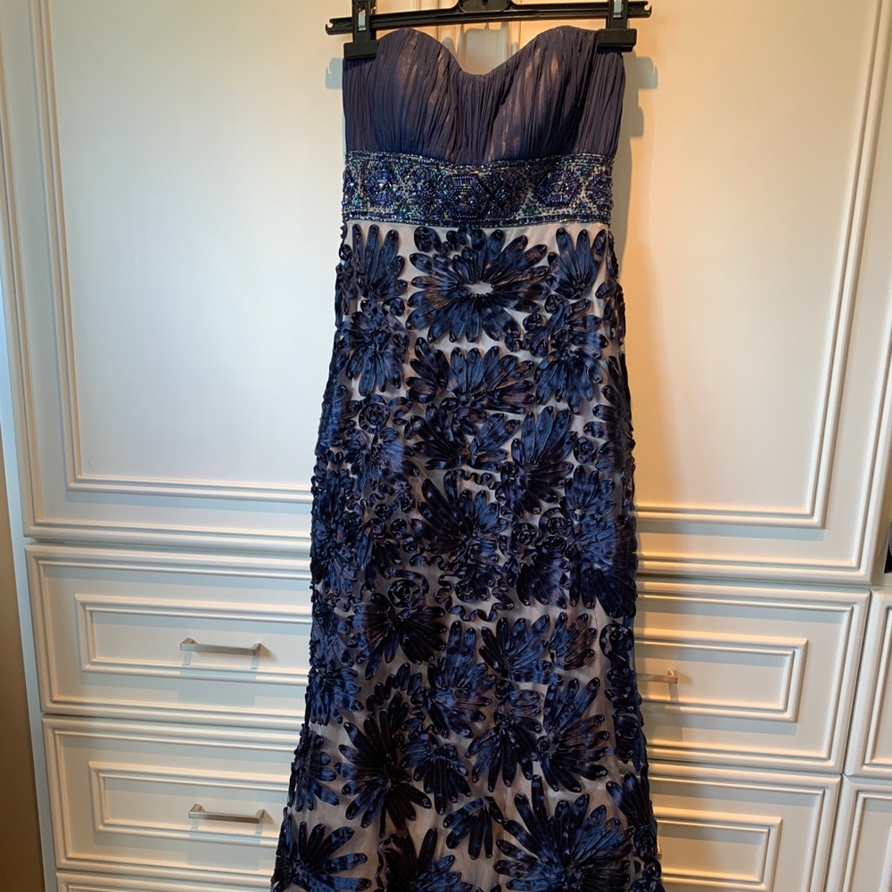 Long blue strapless gown with beading